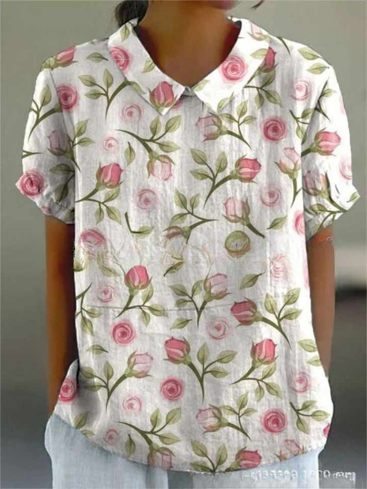 Woman modelling a floral shirt with a loose and comfortable fit.
