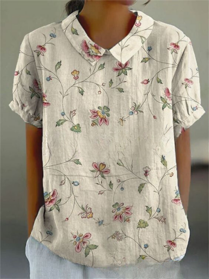  Woman in a casual floral shirt featuring an easy everyday silhouette.