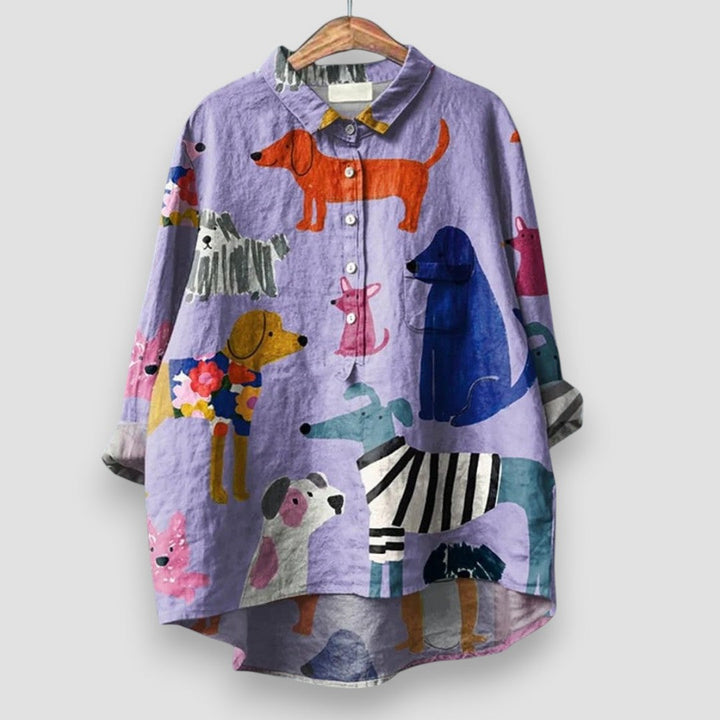 A dog print shirt against a plain background.