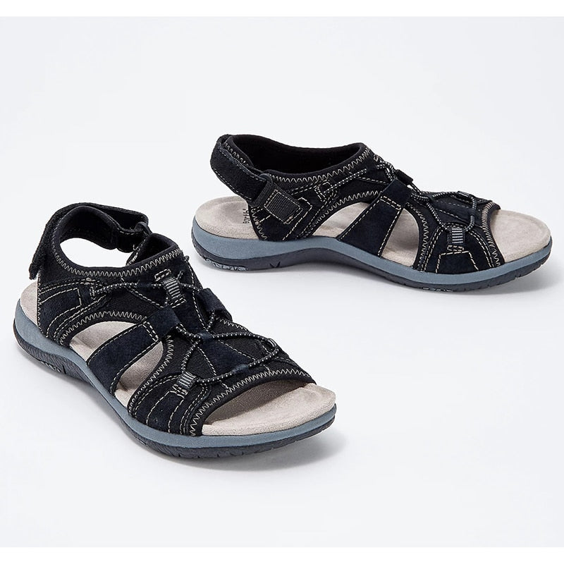 Adjustable strap sandals for casual summer wear on a plain background.