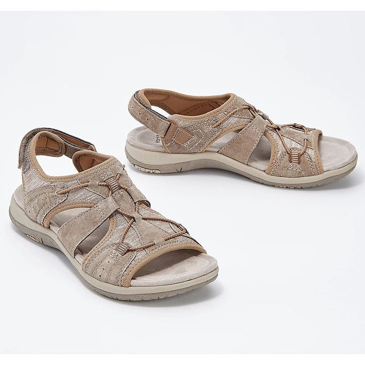 Strappy walking sandals with an open-toe design on a plain background.