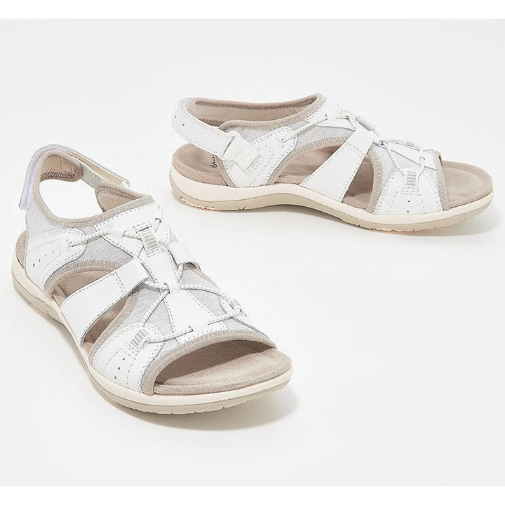 Warm-weather sandals with secure straps on a plain background