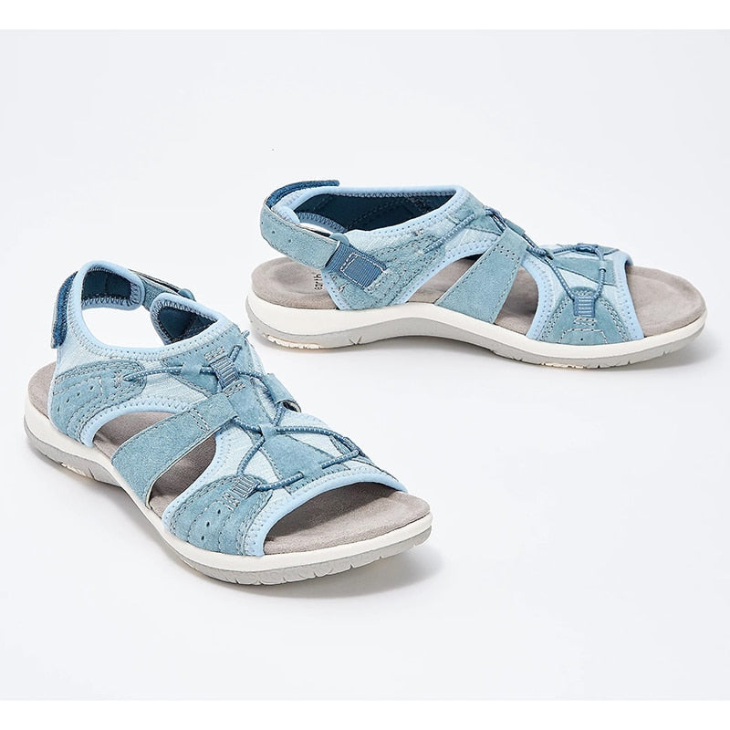 Breathable walking sandals on a plain background.