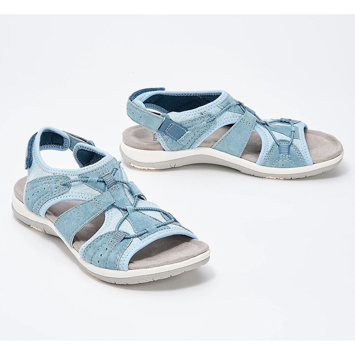 Breathable walking sandals on a plain background.