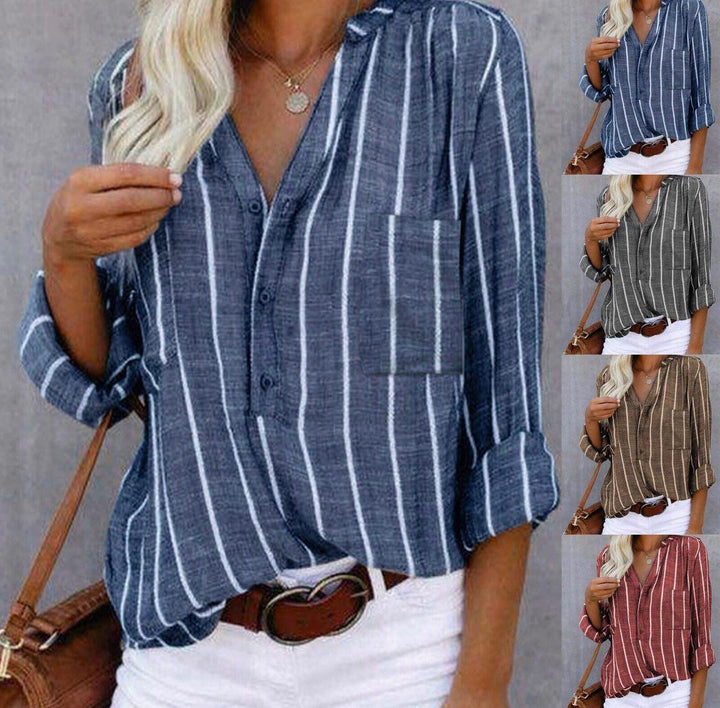  Female in a vertical stripe blouse with a loose and airy silhouette.