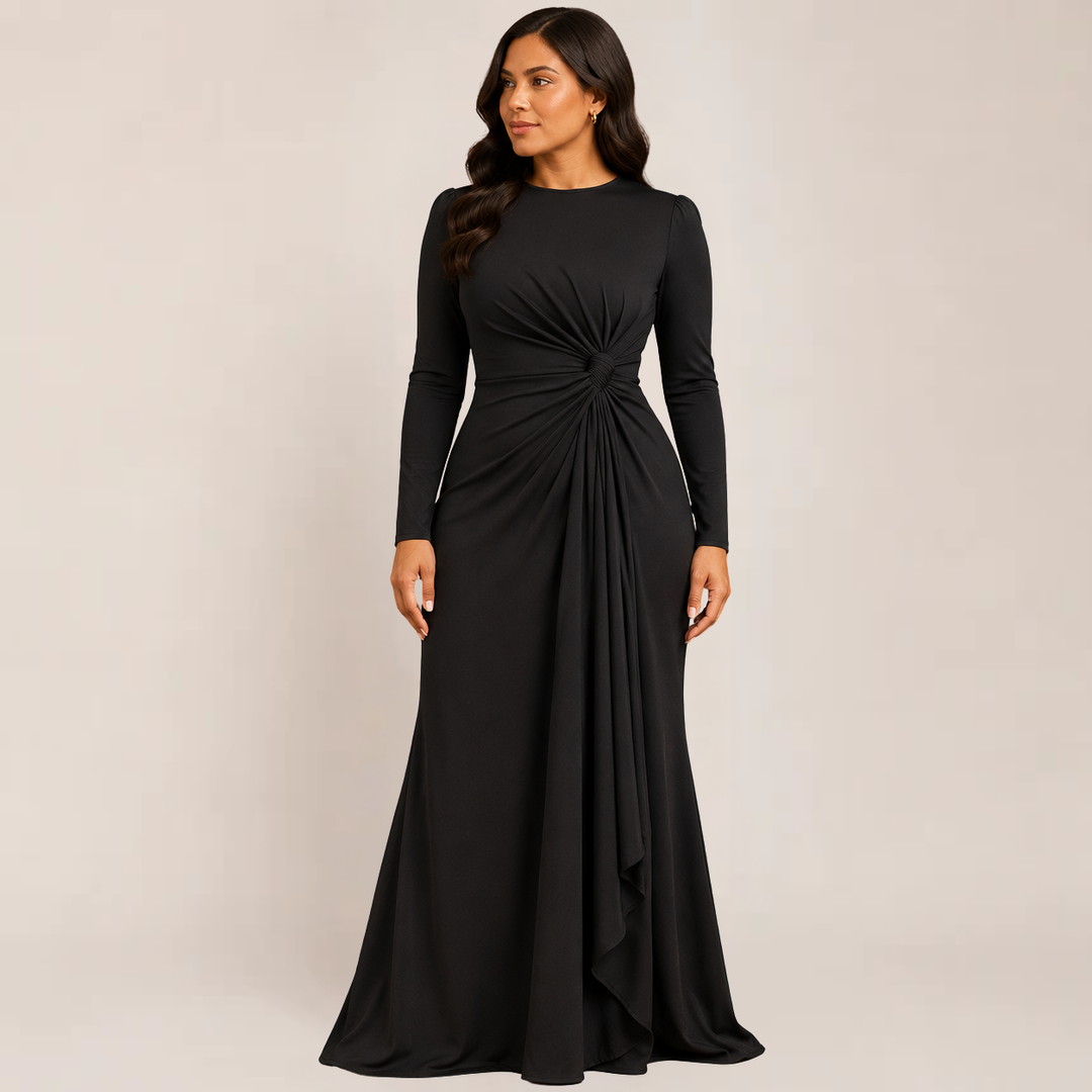 Female wearing a ruched long sleeve bodycon dress on a plain background.