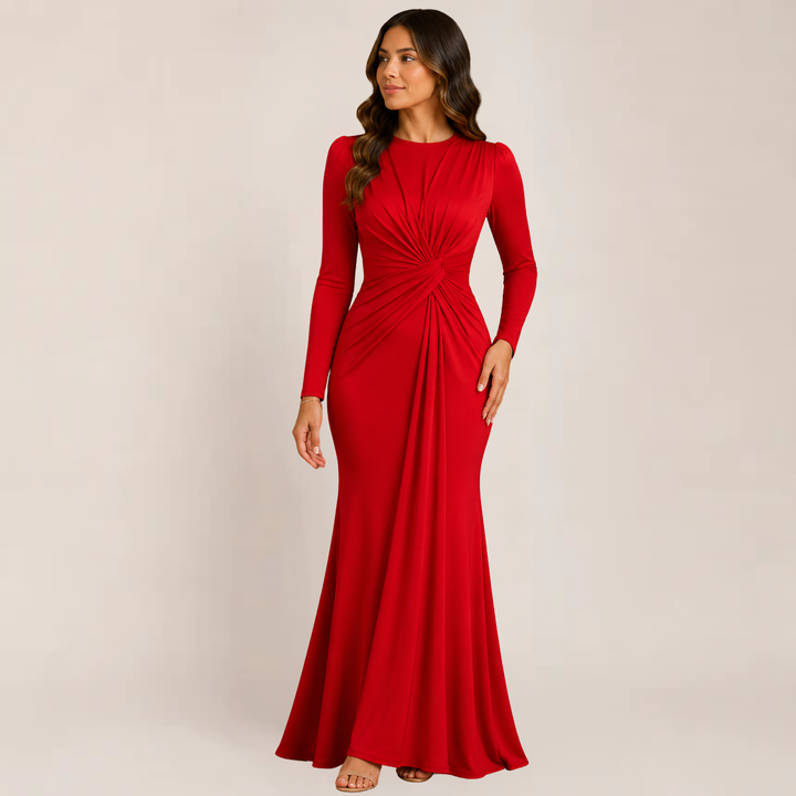 Model wearing a ruched fitted dress designed for evening events on a plain background.