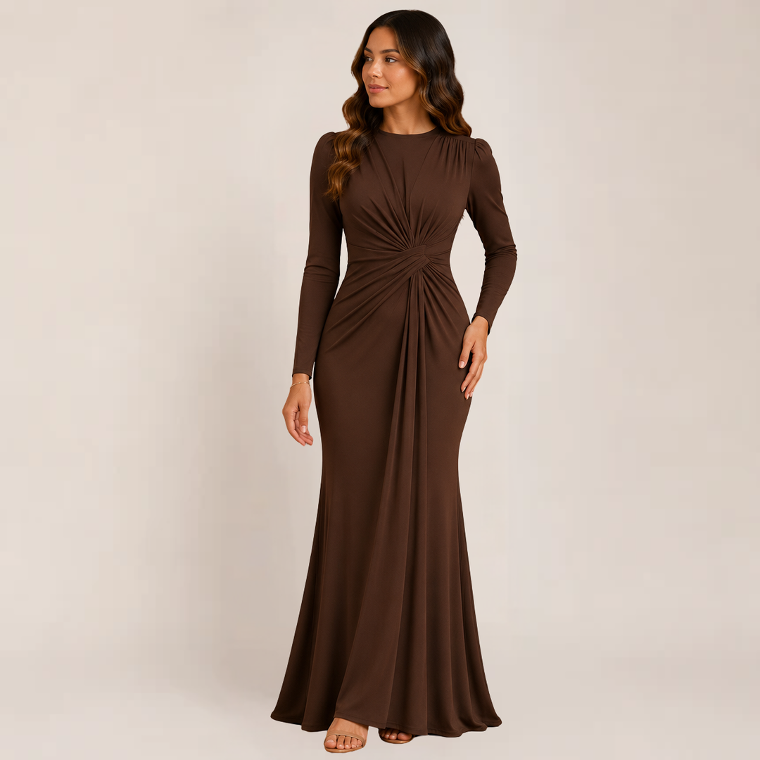  Female model wearing a fitted occasion dress with soft gathered accents on a plain background.
