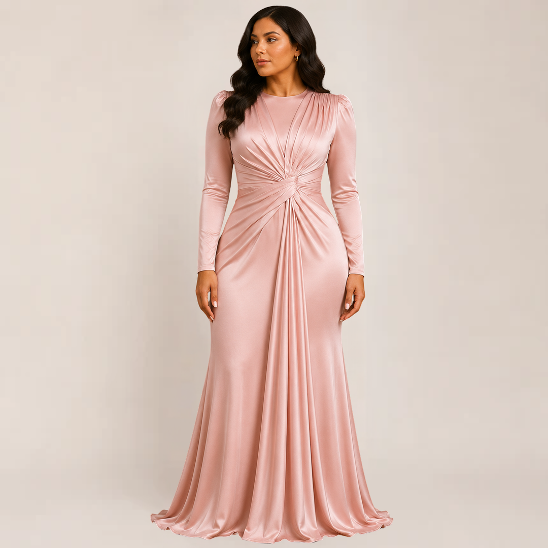  Woman in a long sleeve dress designed for formal styling on a plain background.