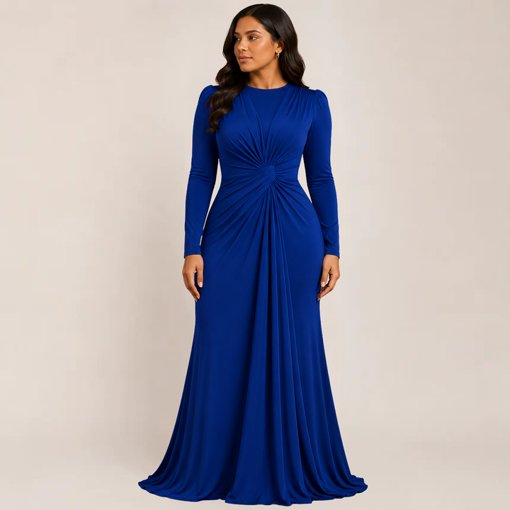 Model posing in a curve-hugging party dress with long sleeves on a plain background.