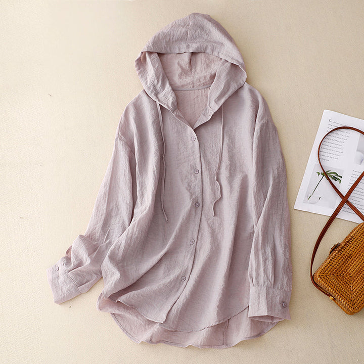 A lightweight hooded button-front layer against a plain background.