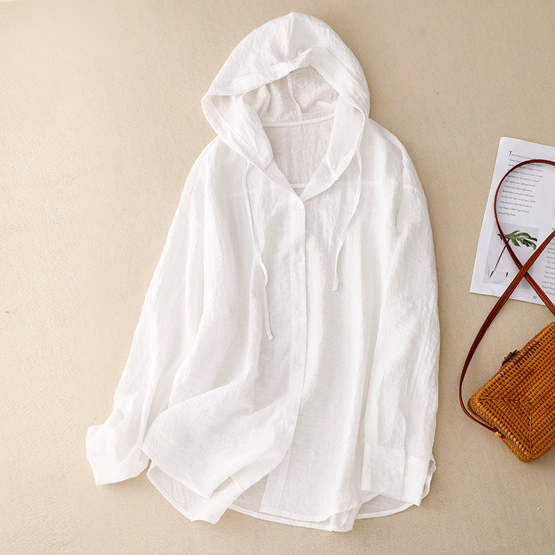 A relaxed fit hooded outer layer with button detailing.