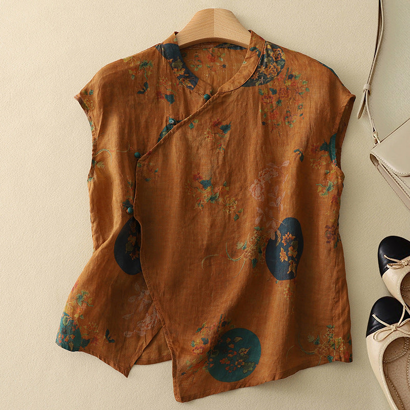 
Woman in a flowy floral top featuring a mandarin neckline on a plain background.