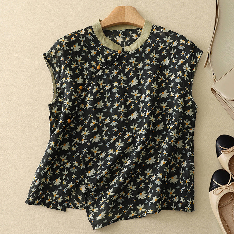 Female wearing a sleeveless printed blouse with a relaxed silhouette.