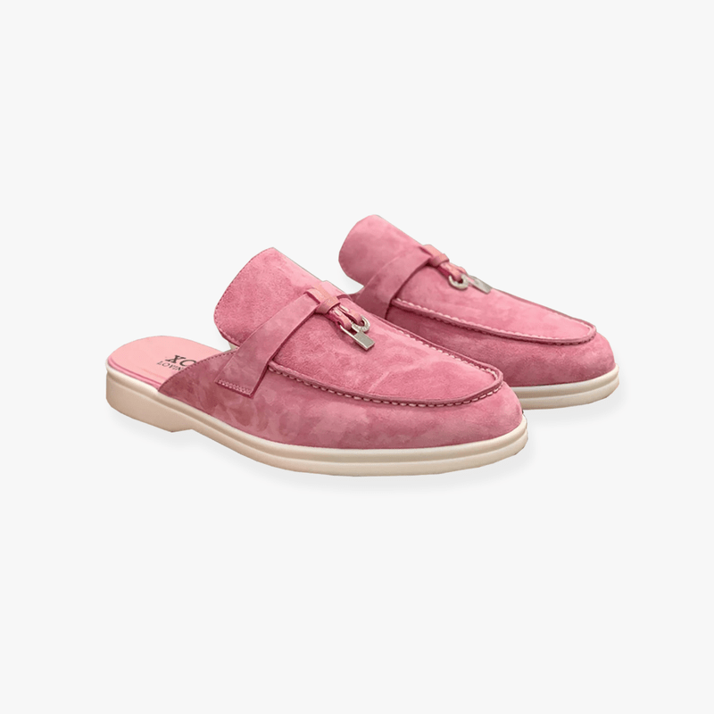 Clean backless mule shoes with buckle detail.