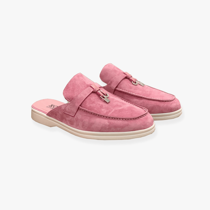 Clean backless mule shoes with buckle detail.