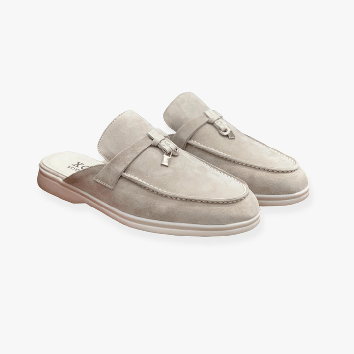 Casual mule shoes on a plain background.