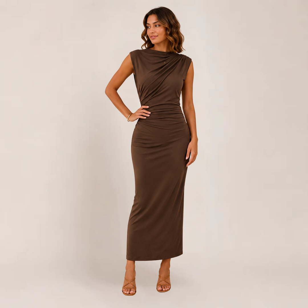 Female model in a sleek occasion dress for night-out styling on a plain background.