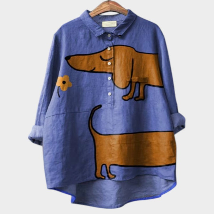 Oversized dog print shirt against a plain background.