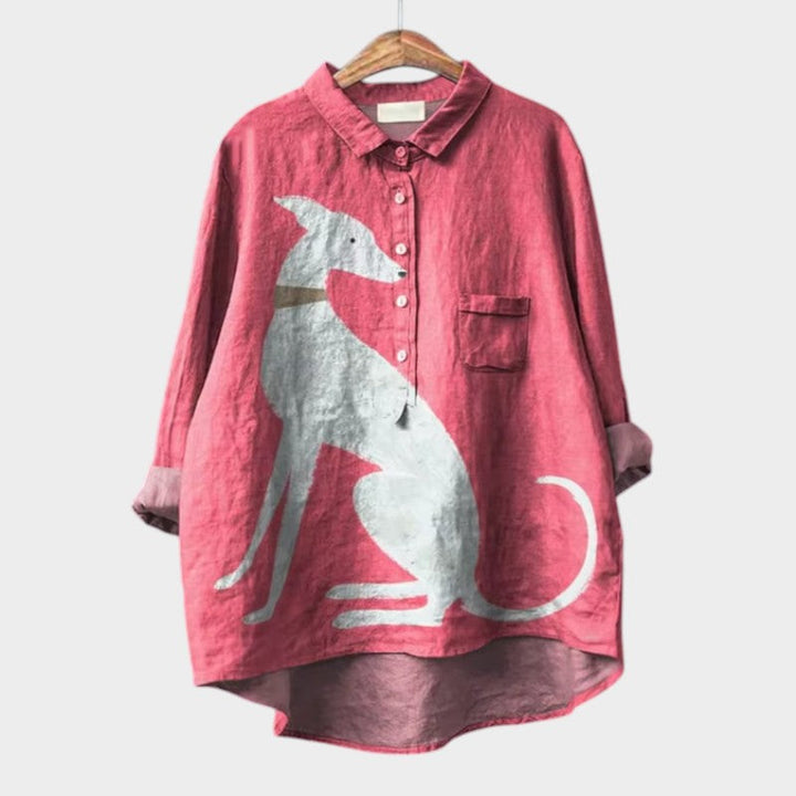 Relaxed dog print blouse on a plain background.
