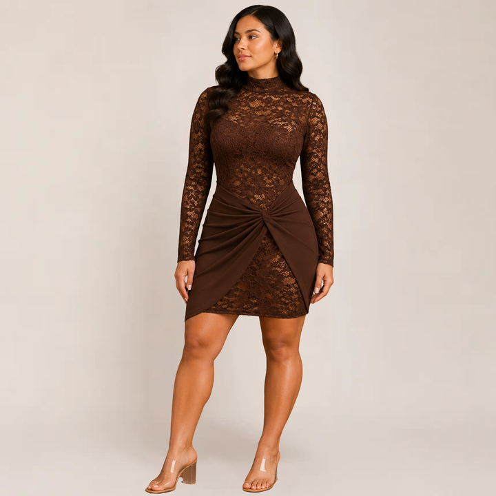 Female model in a long sleeve lace detail dress on a plain background.