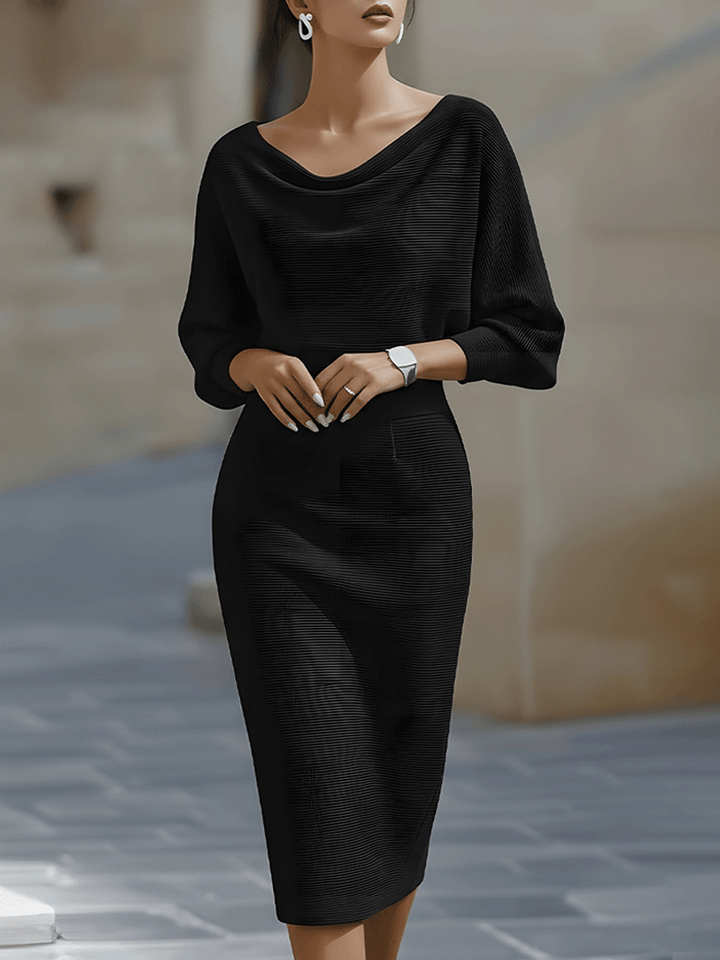 Model wearing a white fitted midi dress with batwing sleeves on a plain background.