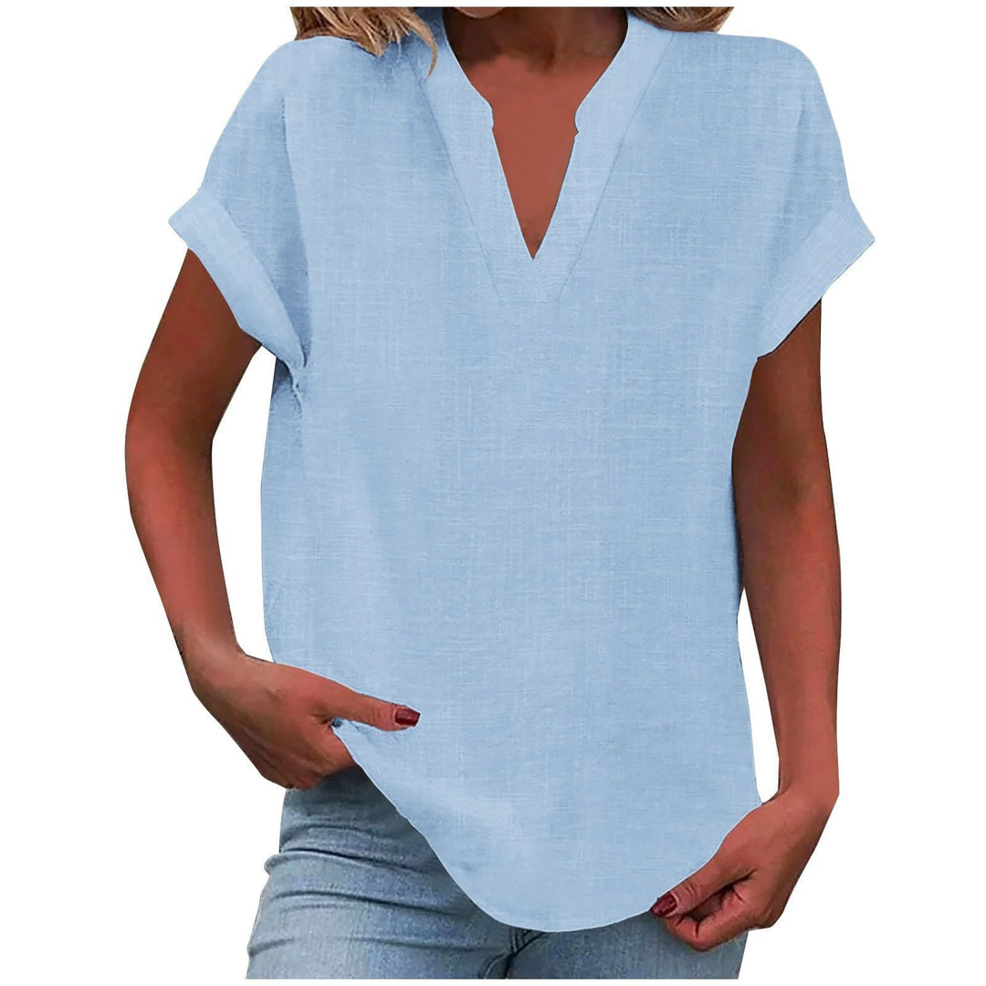  Woman in a smart-casual blouse featuring a relaxed silhouette and notched neckline.