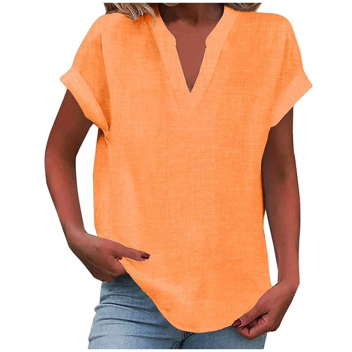  Female modelling a versatile blouse with a relaxed fit and simple styling.