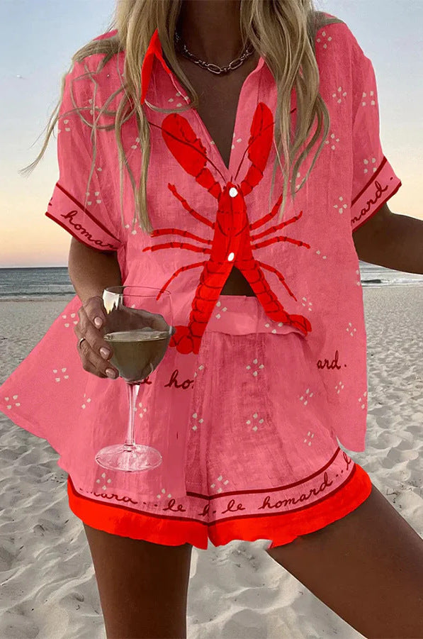 Woman wearing a summer two piece outfit with matching top and shorts on a plain background.