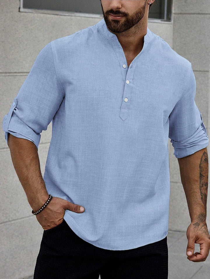 Male model wearing a breathable casual shirt on a plain background.