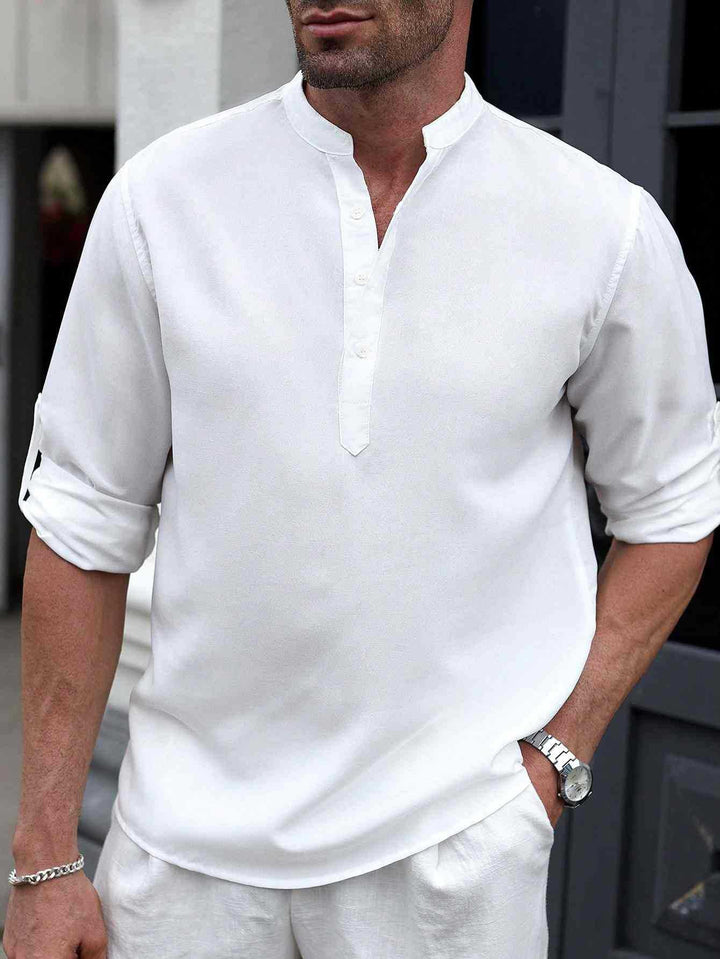 Male model wearing a slim fit casual shirt against a plain background.