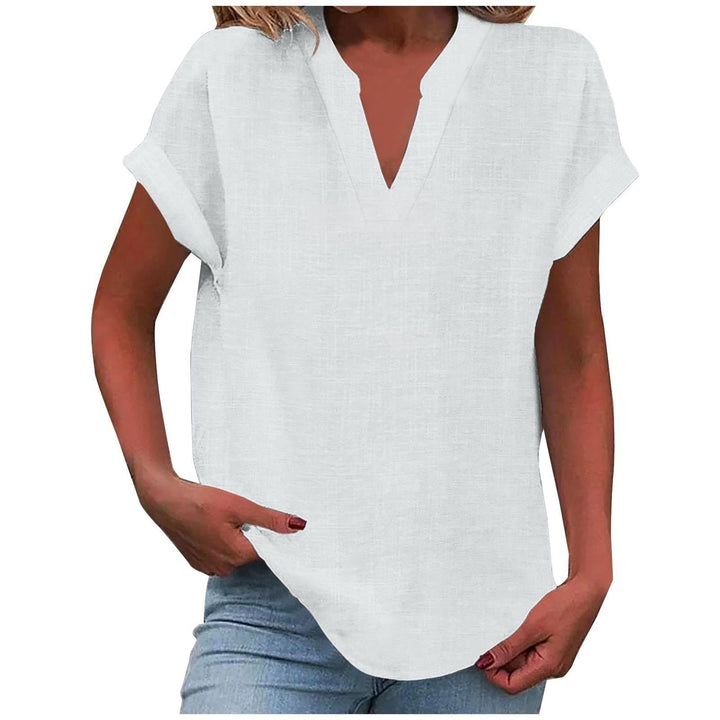  Woman in a casual blouse with a flattering neckline and easy silhouette.