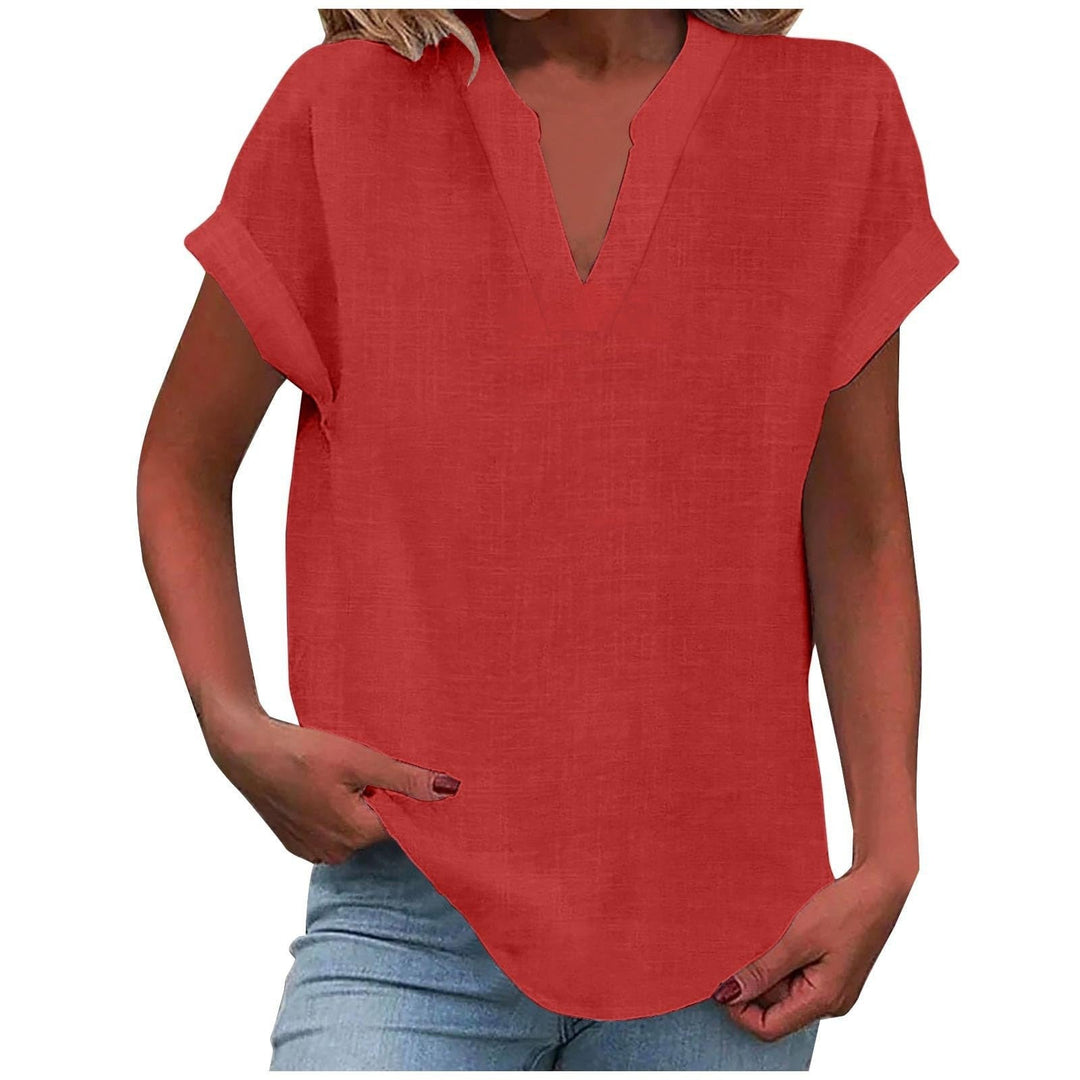  Female wearing a short-sleeve blouse with a clean and polished appearance.