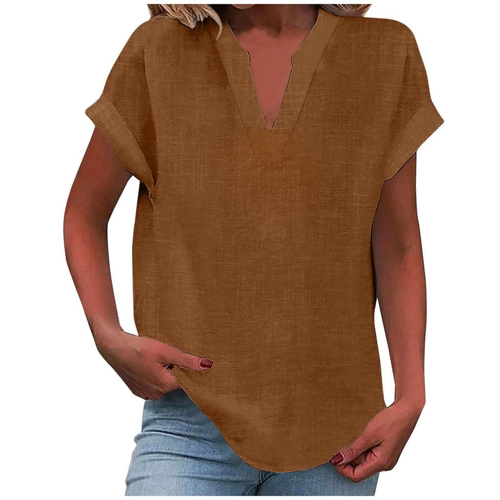 Woman wearing a relaxed blouse paired with a clean and polished look.