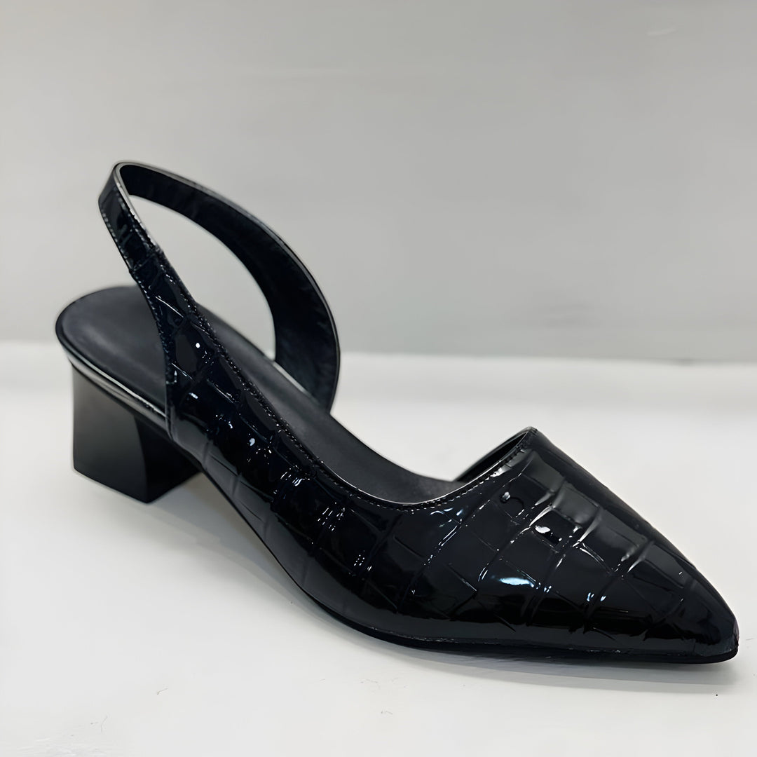 Dressy heels with a clean plain background.