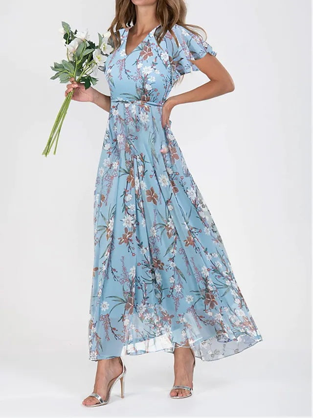 Model wearing a chic midi dress with a simple plain backdrop.