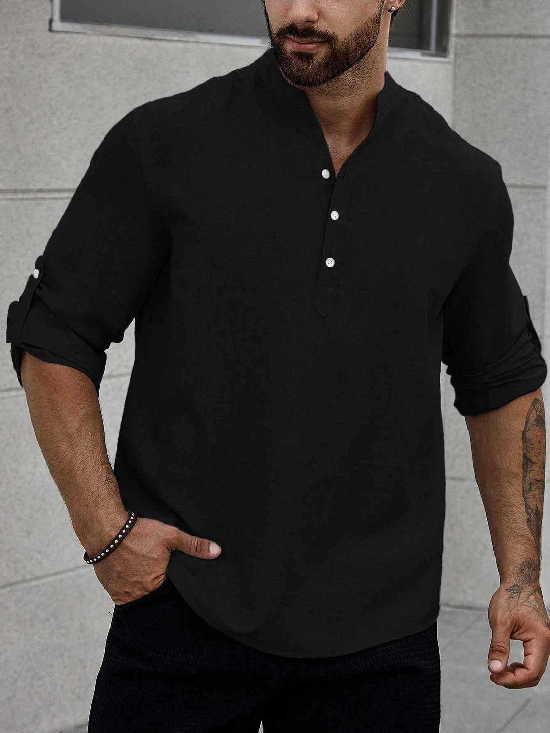 Man in a modern long sleeve shirt with a clean tailored look.