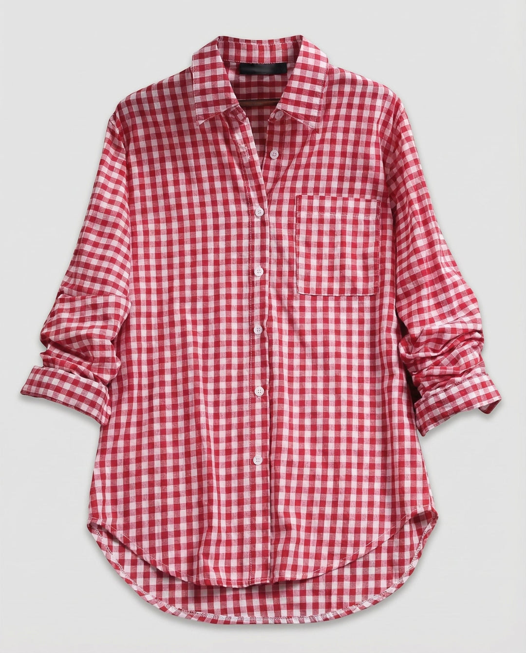 Loose fit checked blouse on a plain background.