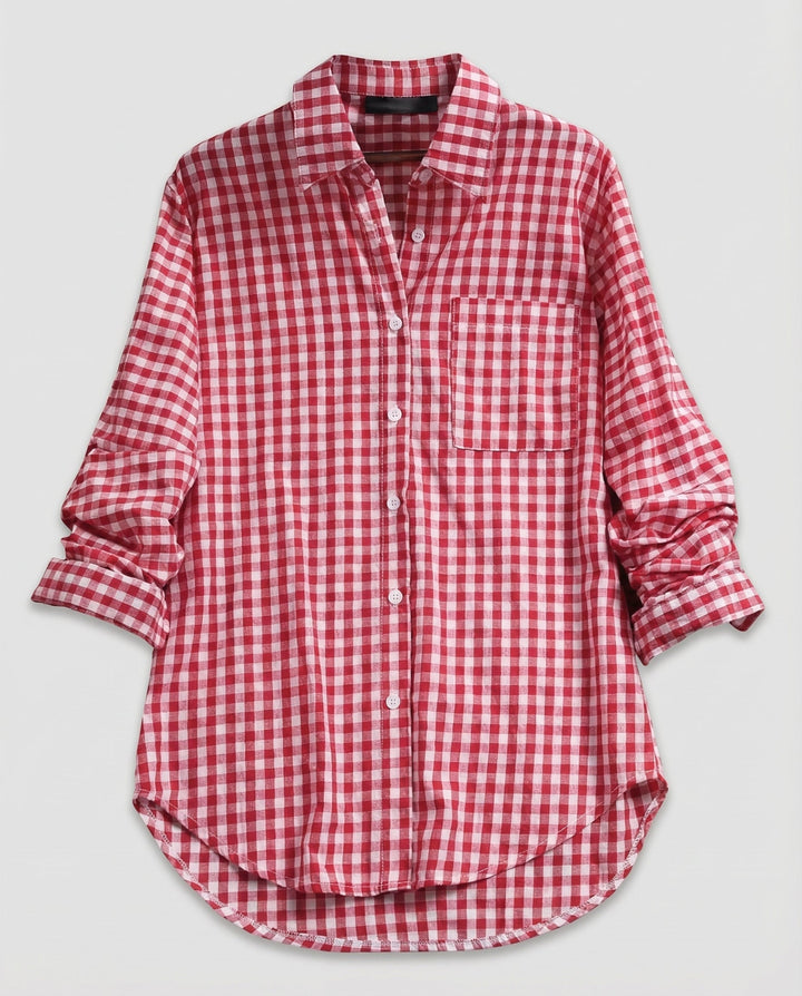 Loose fit checked blouse on a plain background.