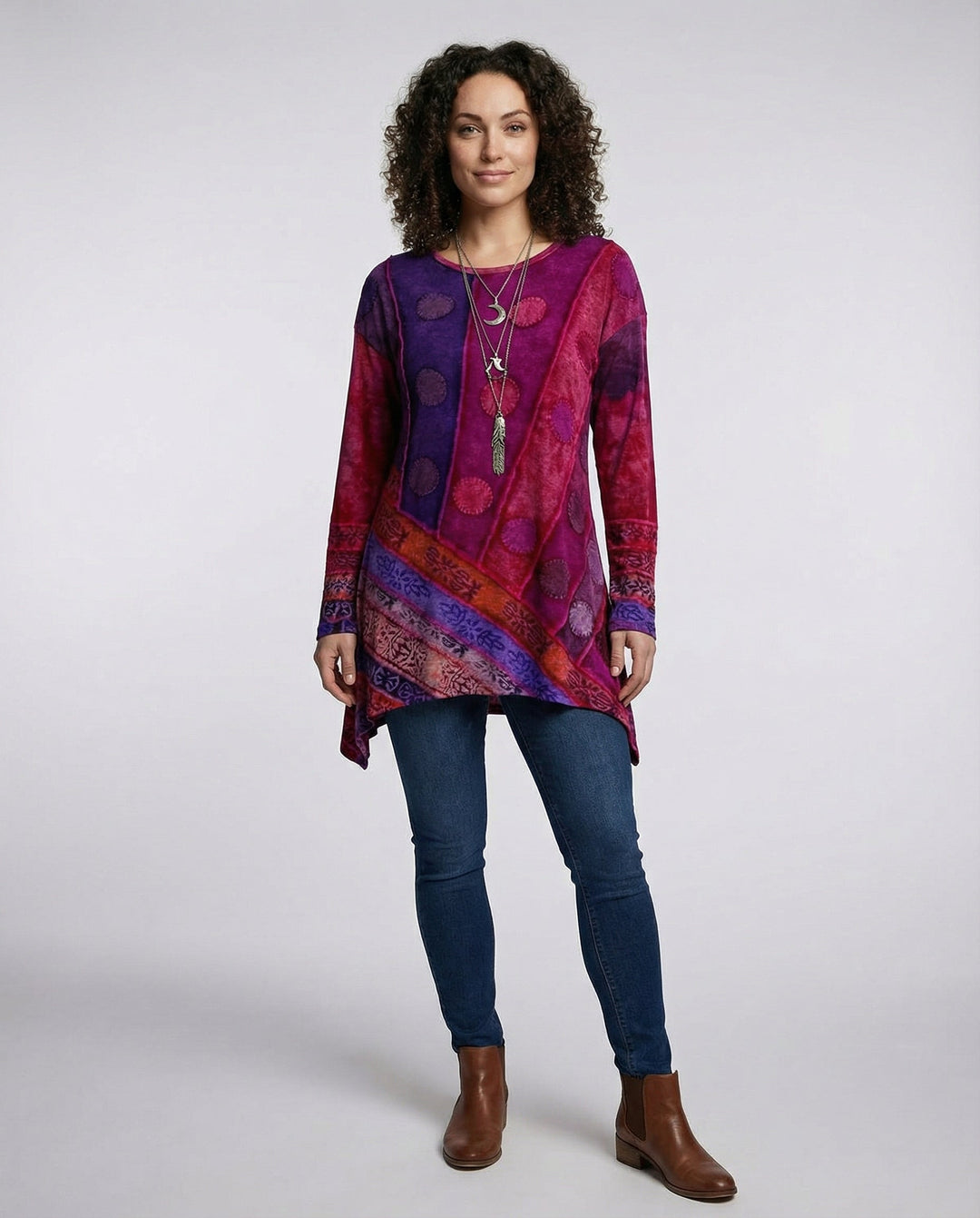 Female modelling a relaxed fit vintage tunic with long sleeves and round neckline.