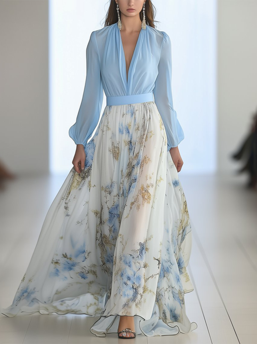 Woman wearing a floral V-neck maxi dress with long sleeves on a plain background.