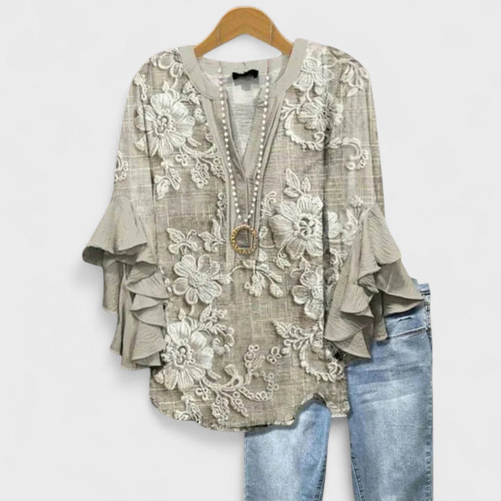  Woman showcasing a lightweight top suitable for work and casual outings.