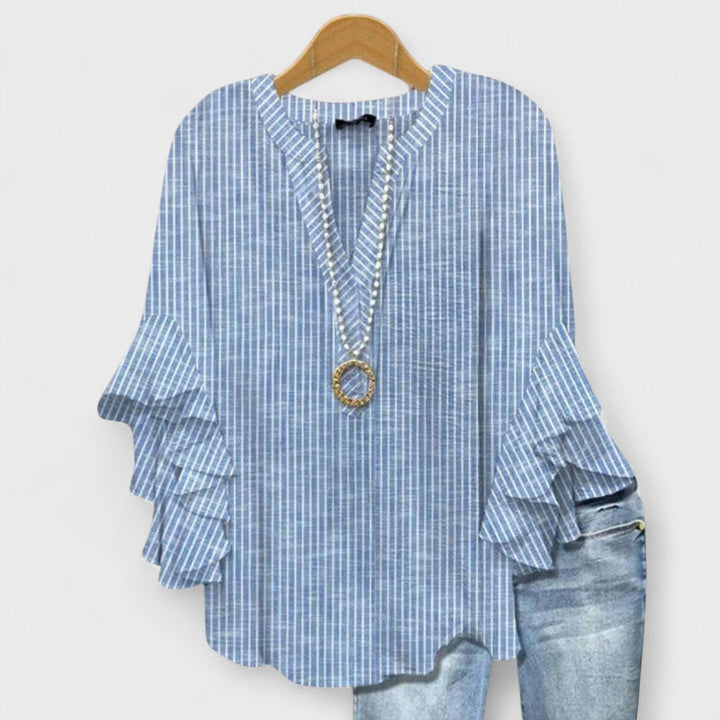 Versatile blouse suitable for office and weekend outfits.
