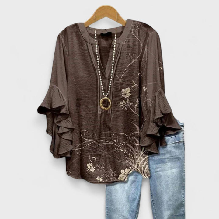 Airy blouse paired for simple everyday styling.