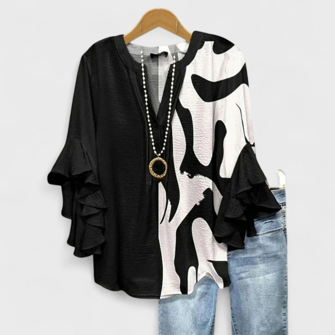Casual blouse with feminine design details.