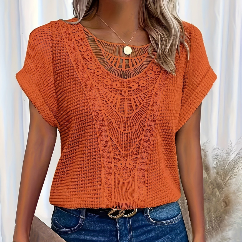  Female wearing a casual lace top with a clean and feminine design.