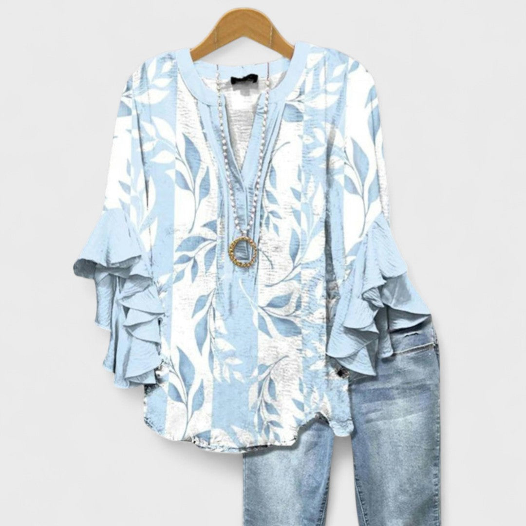 Lightweight blouse for casual daily wear on a plain background.