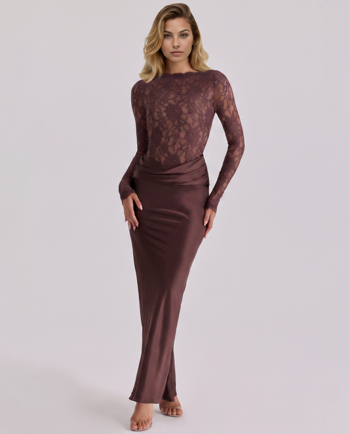 Female wearing a lace long sleeve maxi dress with a flowing satin-look skirt on a plain background.