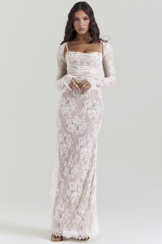 Female modelling a long lace dress with a structured lace-up back.