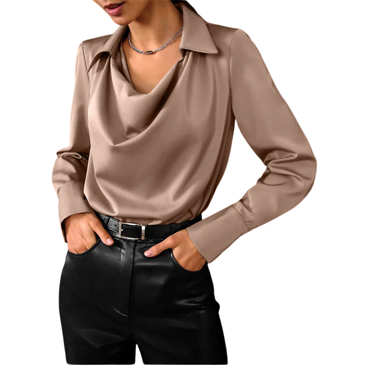 Female model in a satin long sleeve blouse styled for workwear on a plain background.